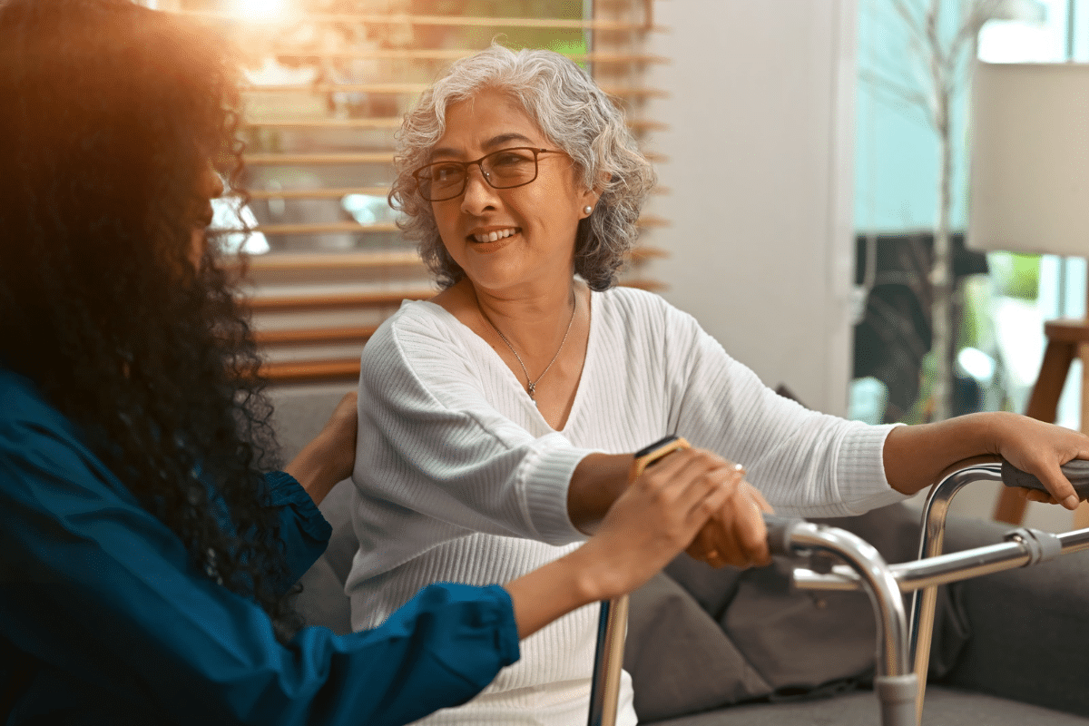 Older woman with a walker in a nursing home.