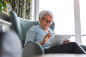 older adult using a tablet