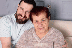 Son and mother sitting on a couch