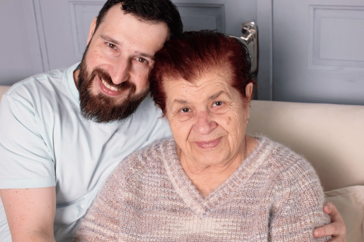 Son and mother sitting on a couch