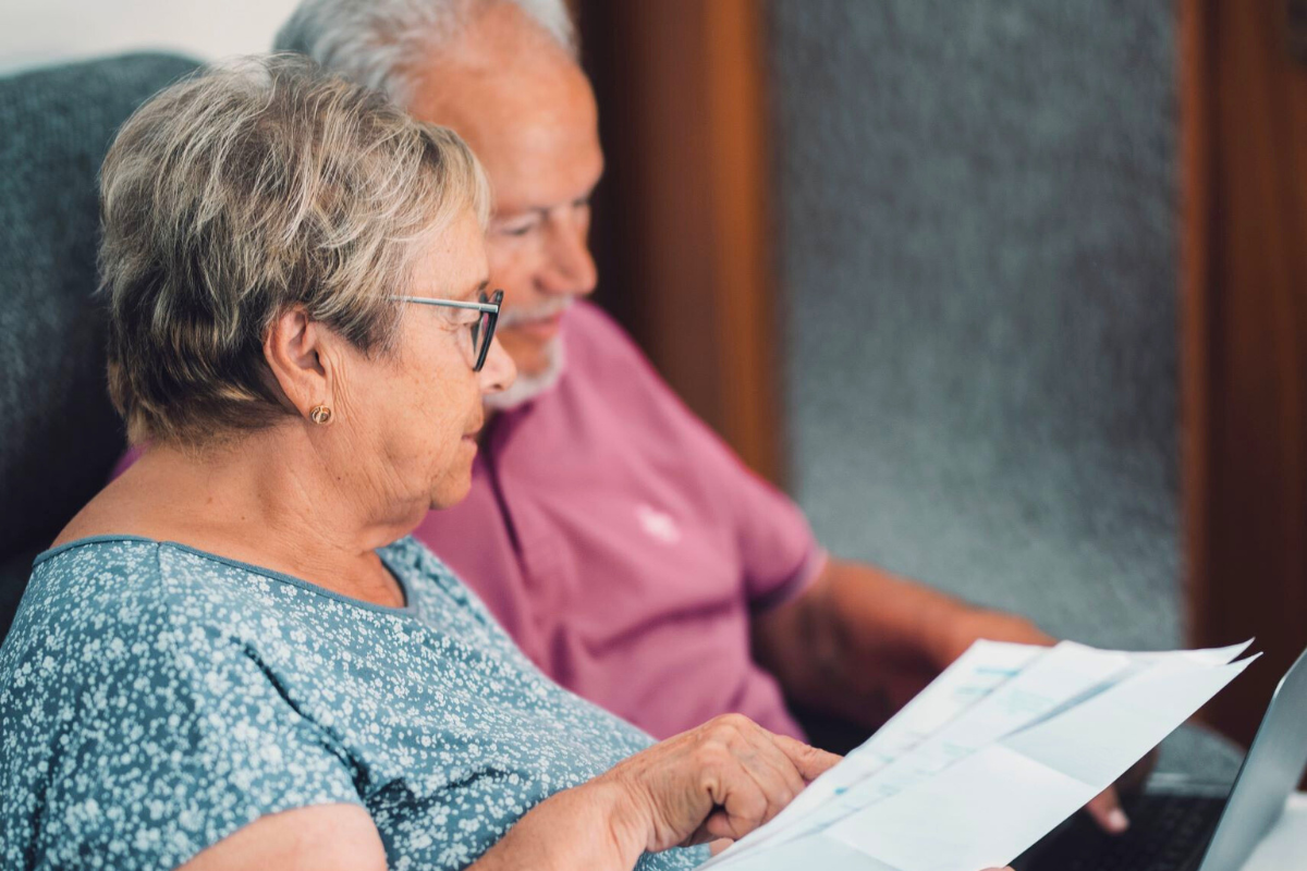 Older adults reviewing long term care planning documents