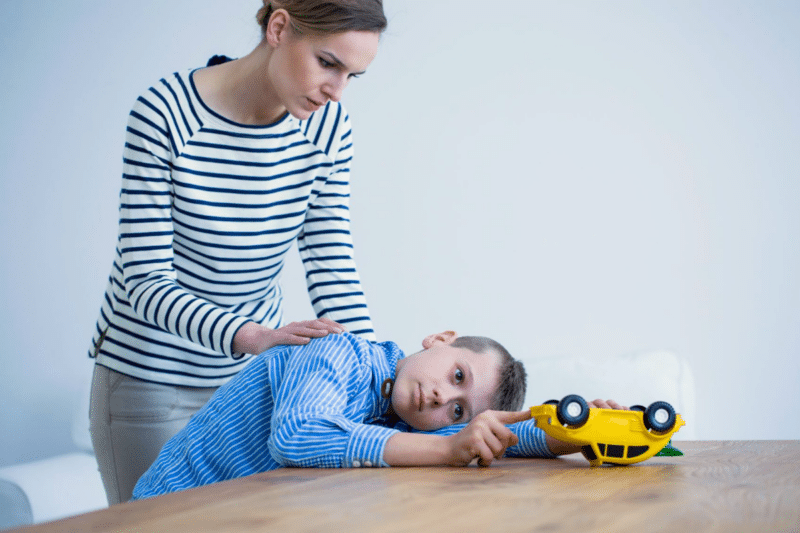 mother consoles child with autism