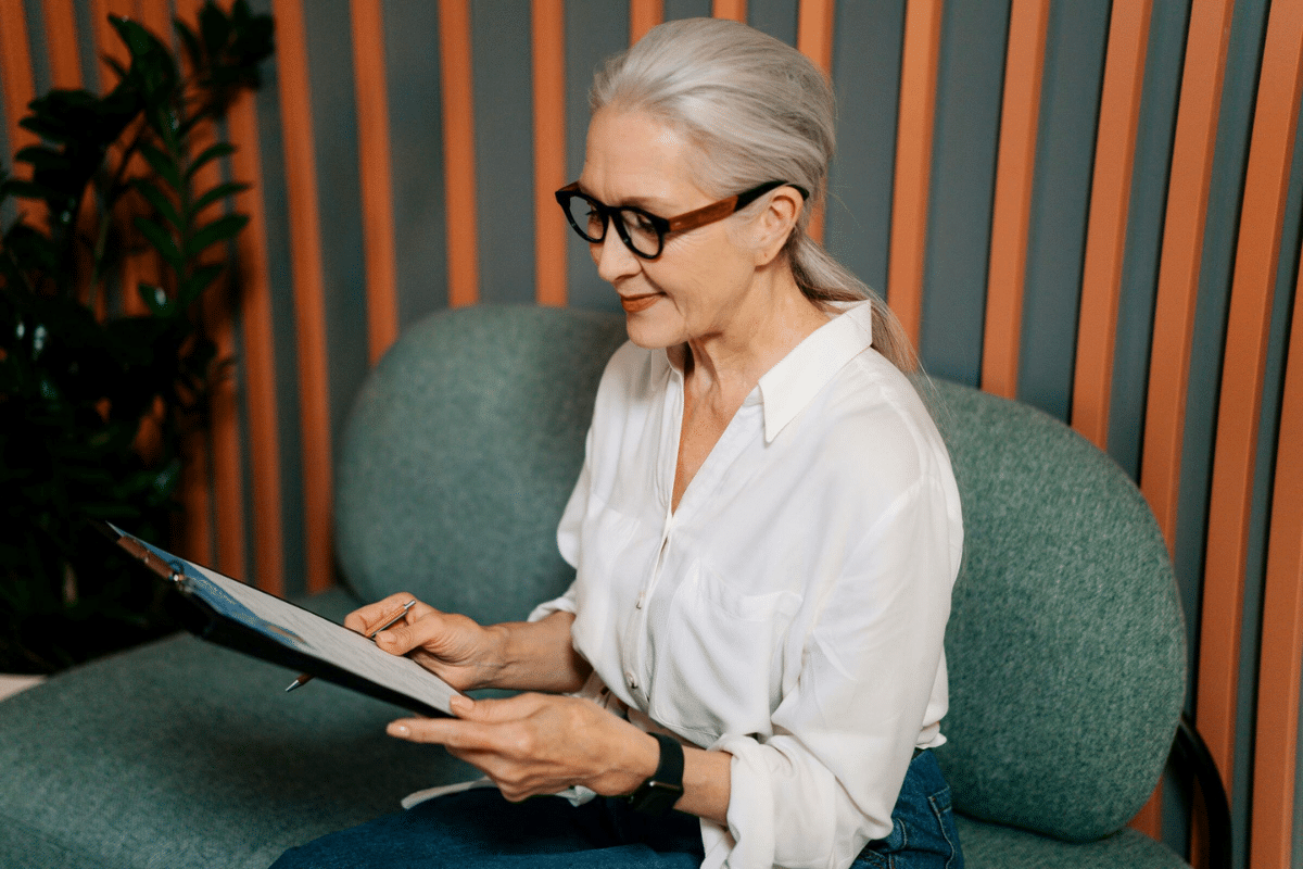 Older adult reading Medicaid information