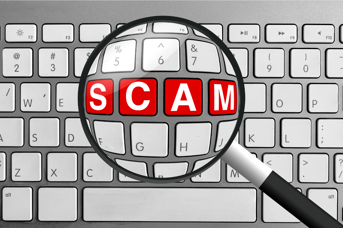 SCAM written on the keys of a keyboard