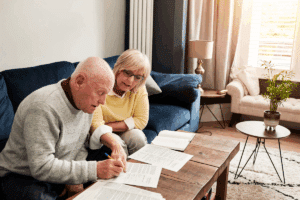 older couple on couch reviewing SAFE Trust documents