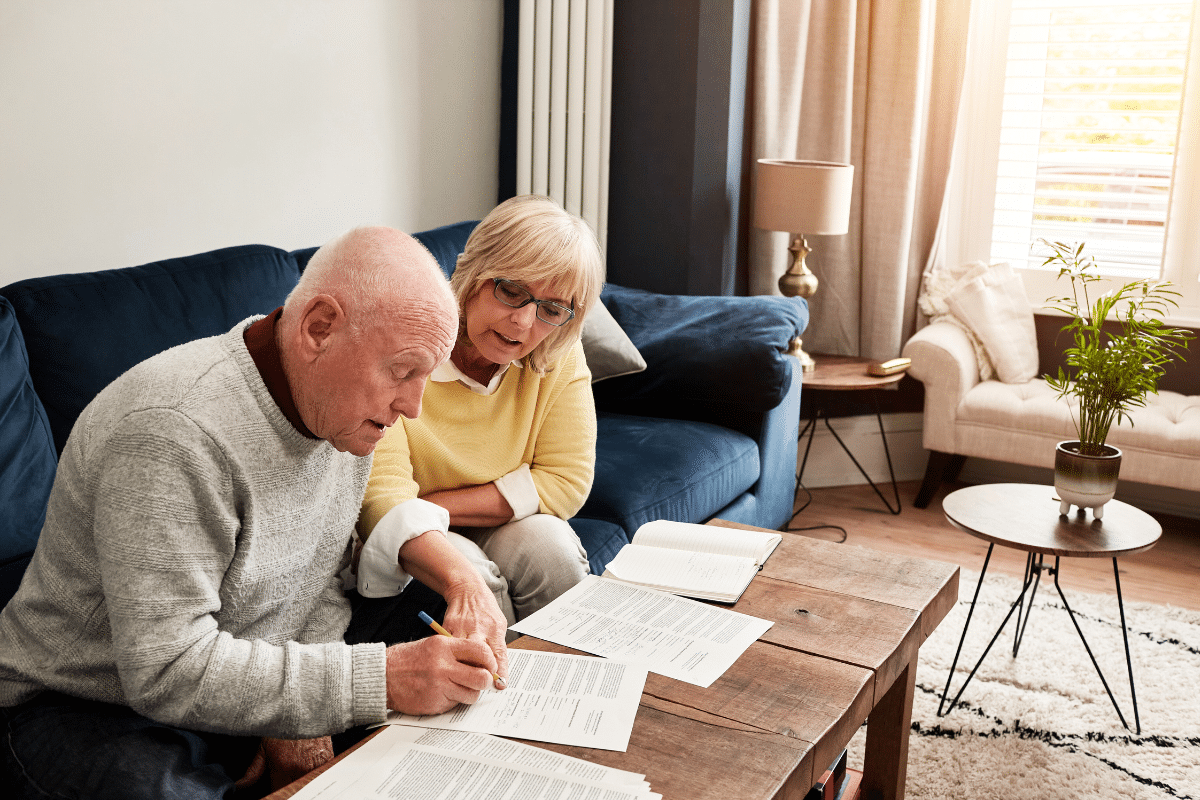 older couple on couch reviewing SAFE Trust documents