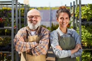 father and daughter standing together in their plant nursery